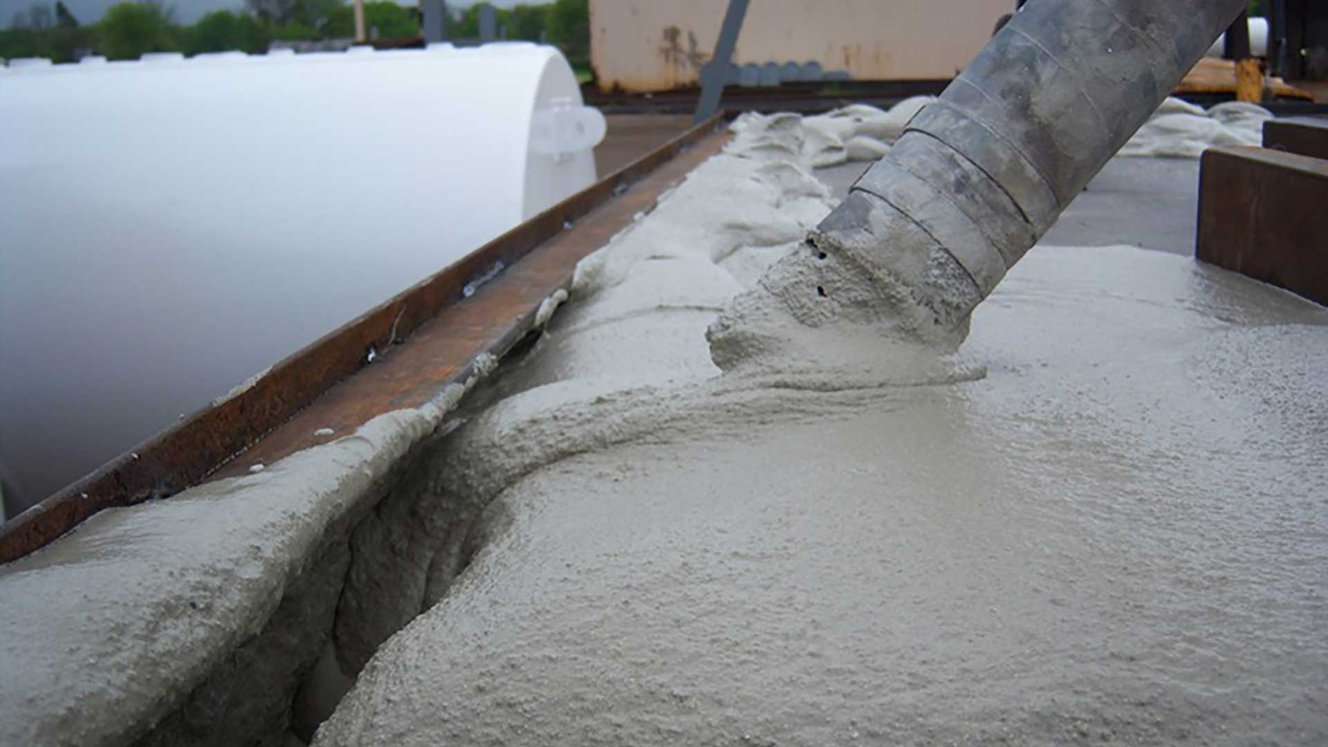 FIREGUARD® steel tank being filled with lightweight thermal insulation material.