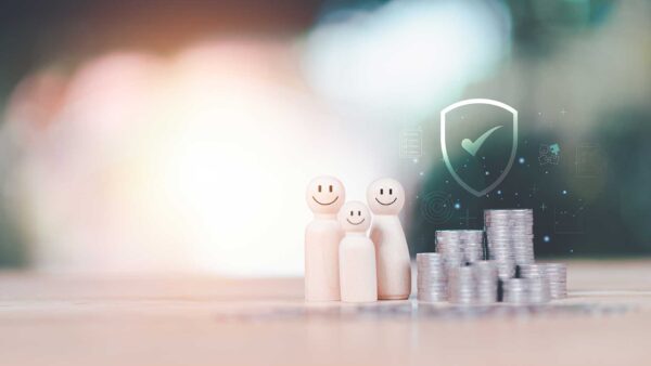 Illustration of three people figures beside stacked coins and a shield icon representing insurance protection, risk management, and financial health.