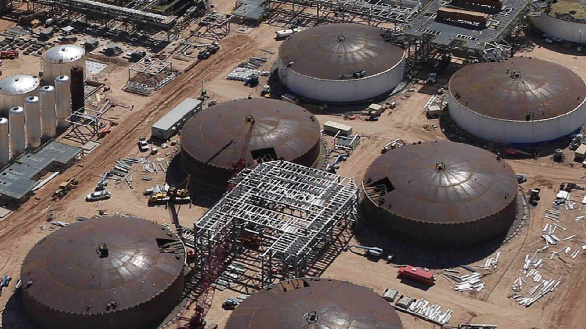 Aerial view of API aboveground storage tanks under construction at an industrial facility.