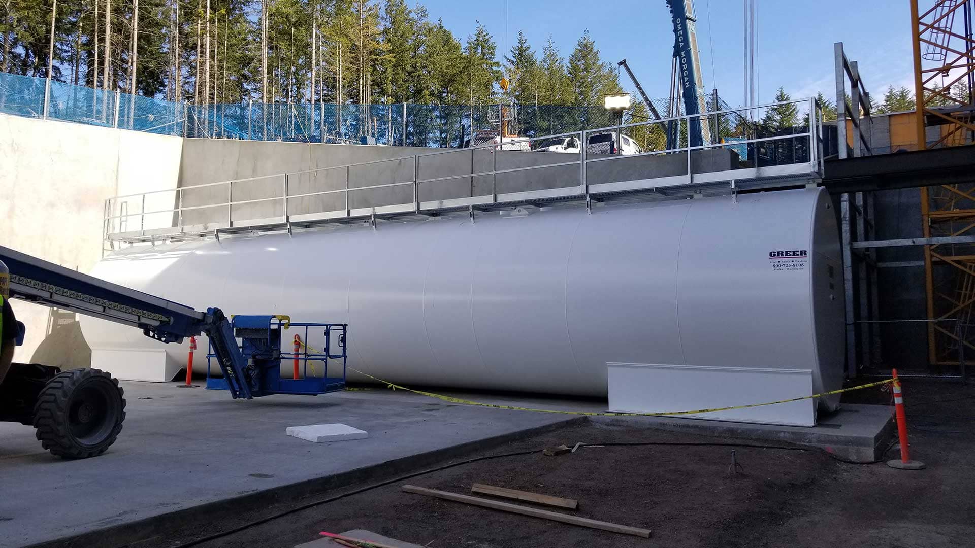 40,000-gallon FIREGUARD® double-wall steel storage tank installed at a site with lift equipment and safety barriers.
