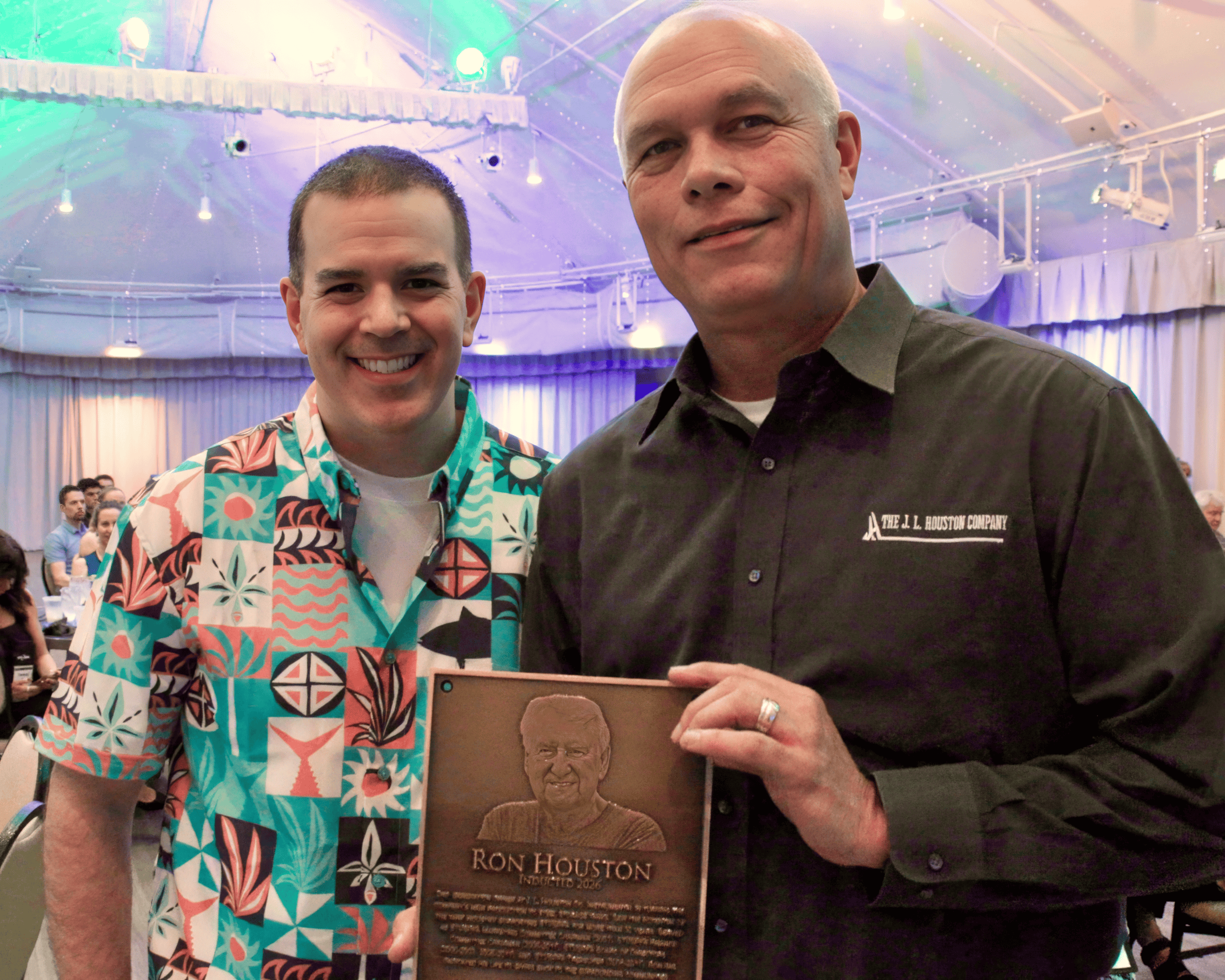 Coby Hayes accepts the STI/SPFA Hall of Fame Award on behalf of Ron Houston.