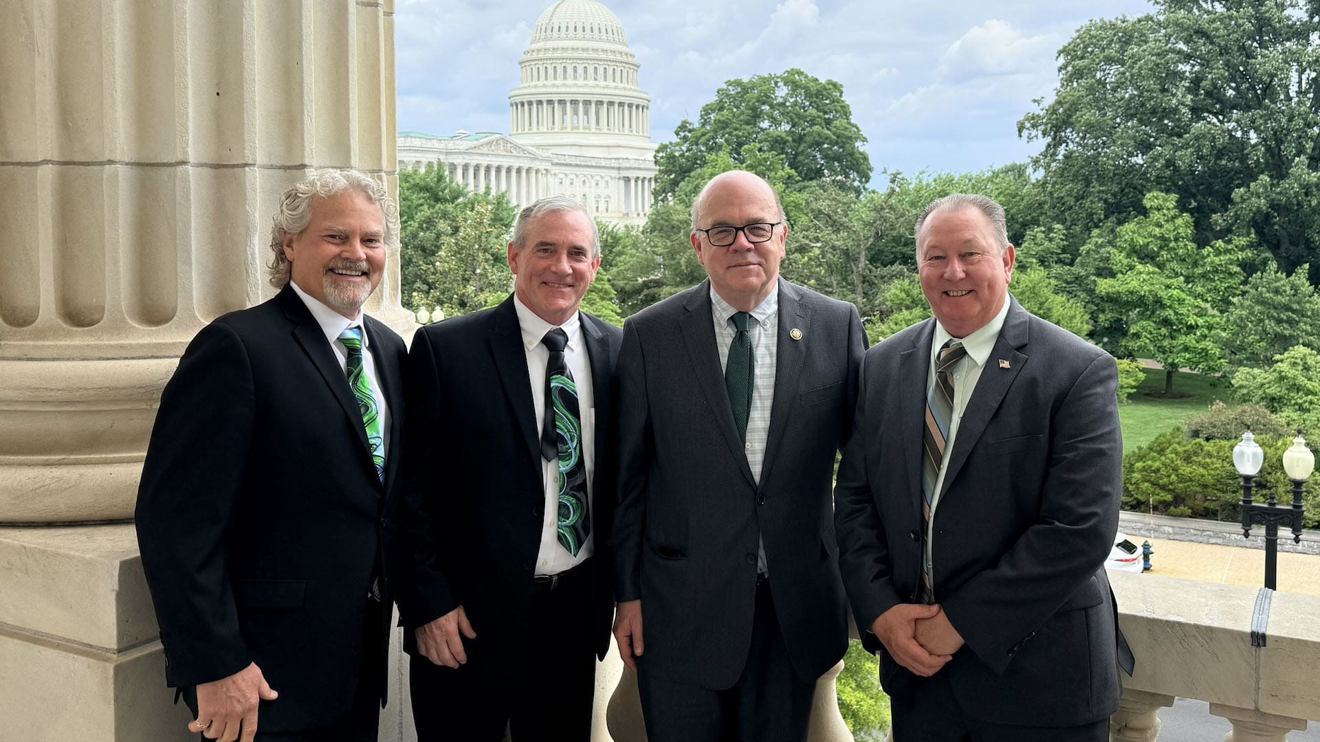 Rep. Jim McGovern (center right) met with Joel Amato (left), Mark Mooney (center left, and Mike Pischke (right).
