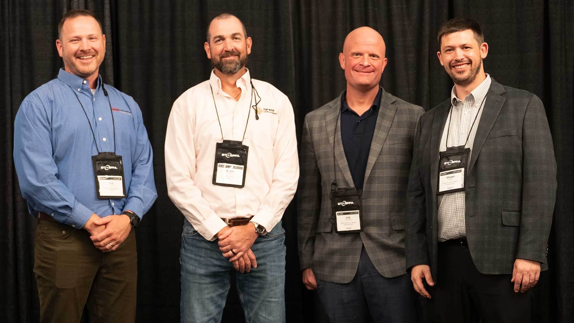 Tarsco Construction, Corp. receives an STI/SPFA Safety Award of Excellence from STI/SPFA and Marsh McLennan Agency representatives.